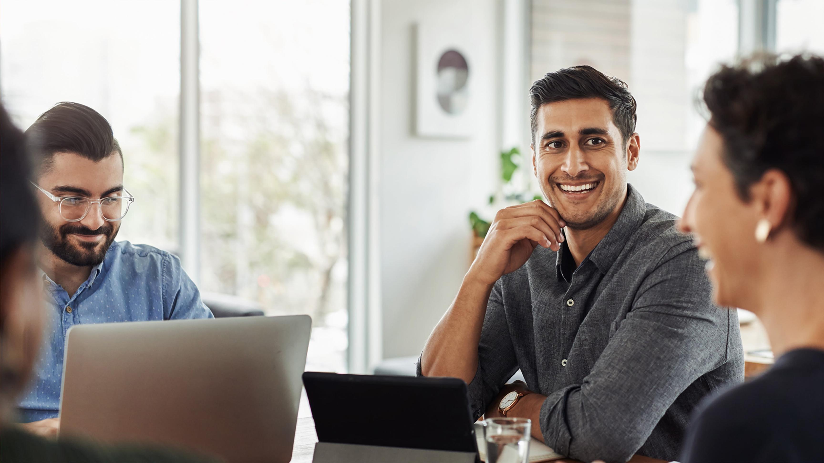 Workshop participants analyzing financial progress measurement data
